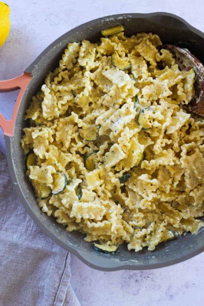 Overhead shot of creamy lemon pasta in a pan. 