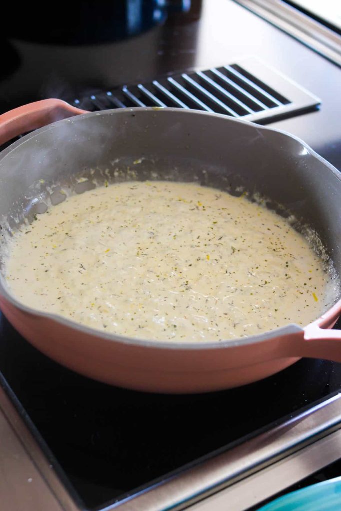 Creamy lemon sauce in a sauté pan. 