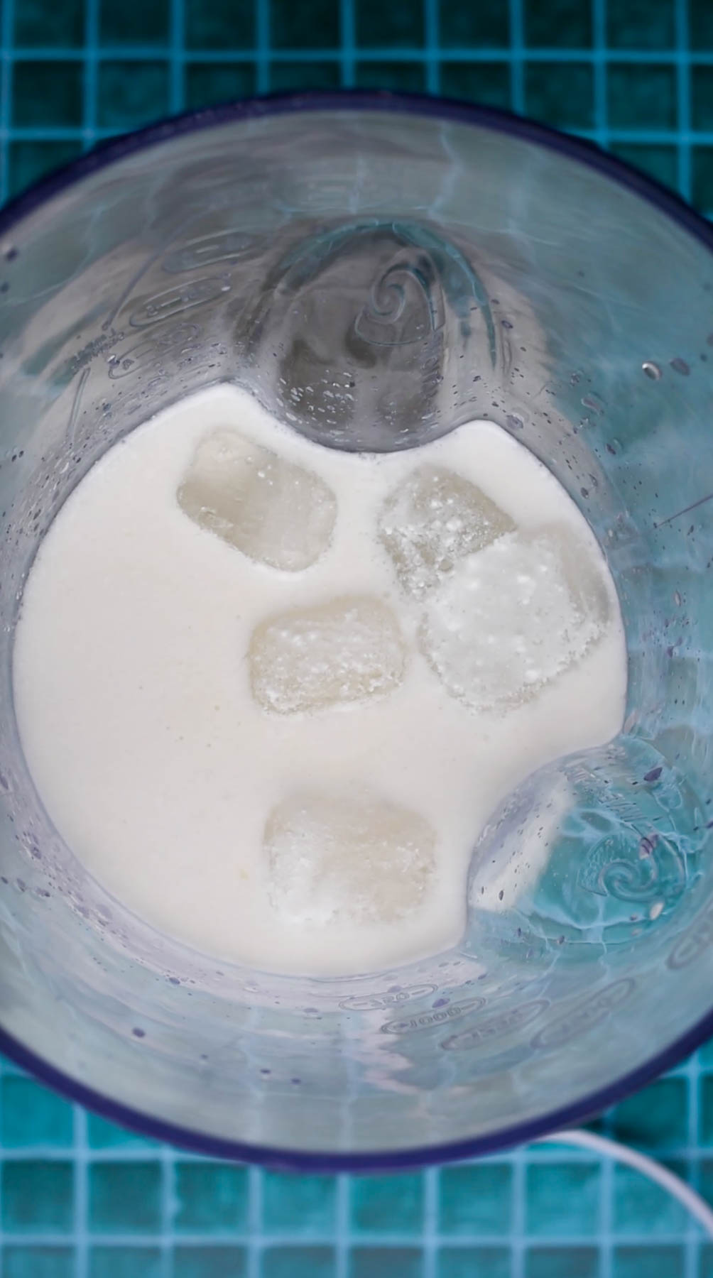 Ingredients for limonada de coco in a blender before being blended. 