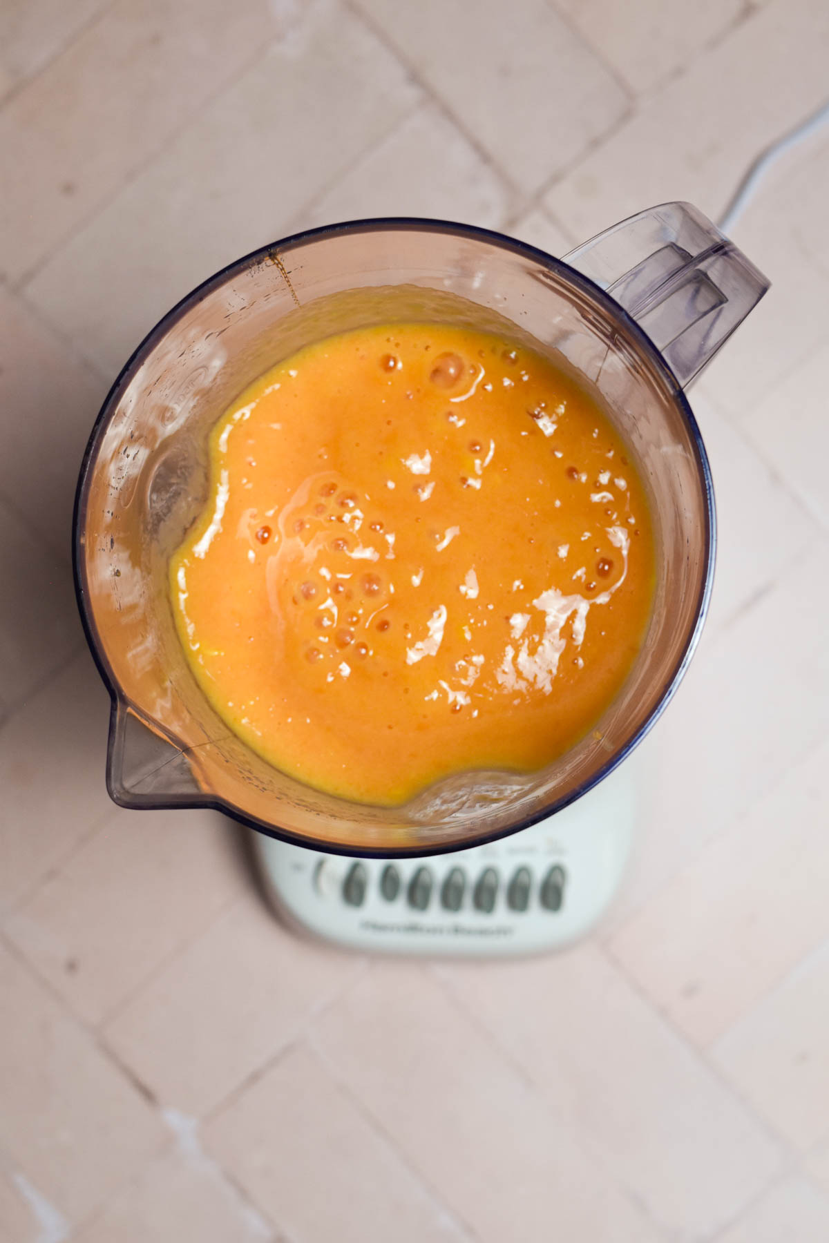 Mango papaya smoothie in a blender. 