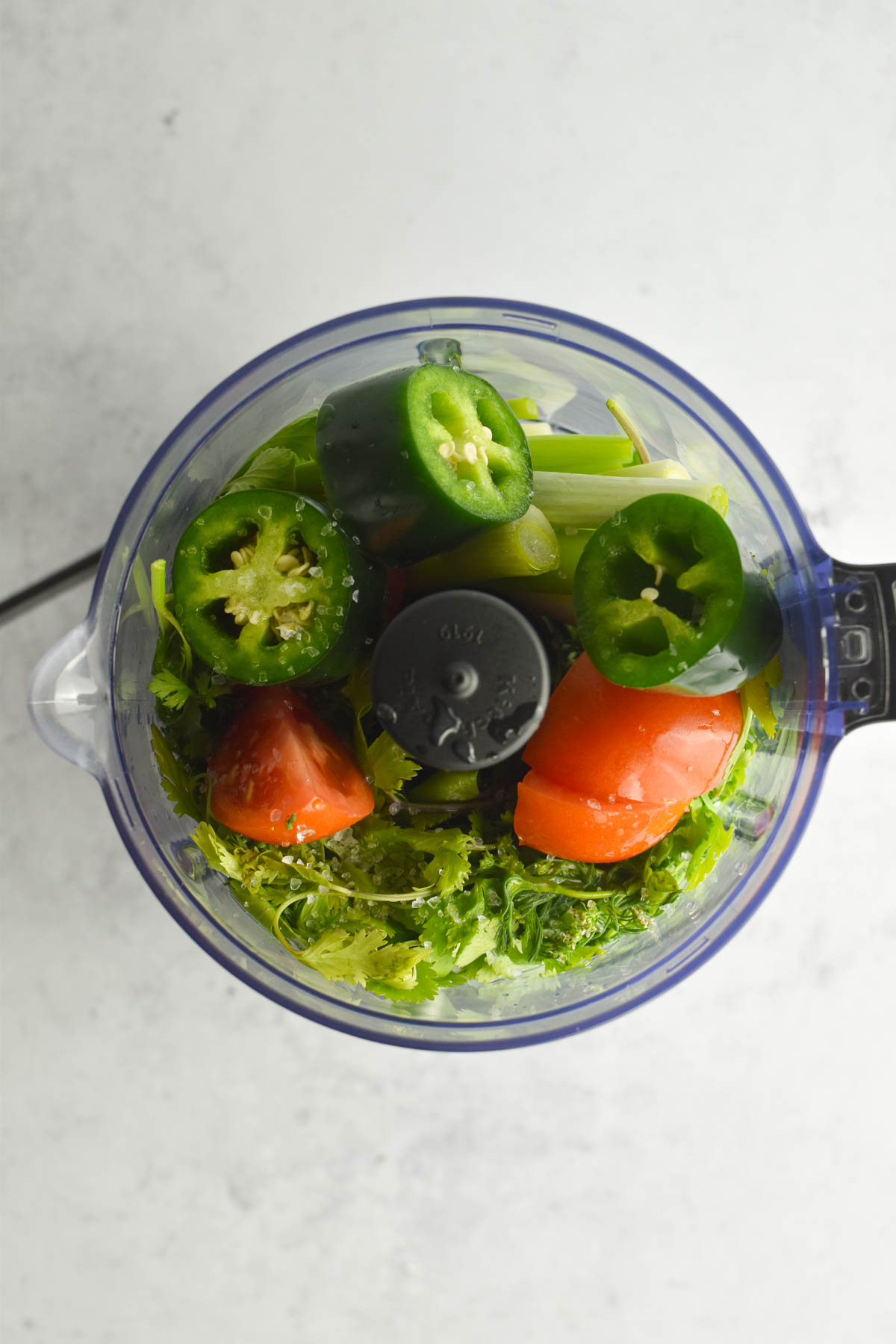 Ingredients for Colombian hot sauce prepped and placed in a food processor. 