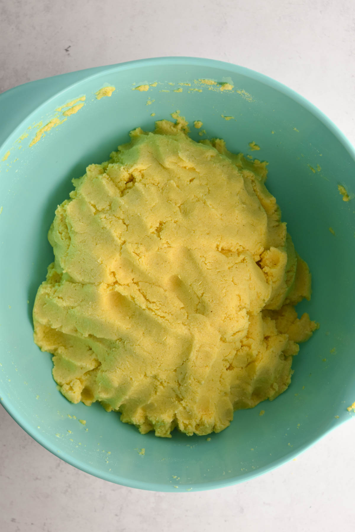 Empanada dough prepared in a mixing bowl. 