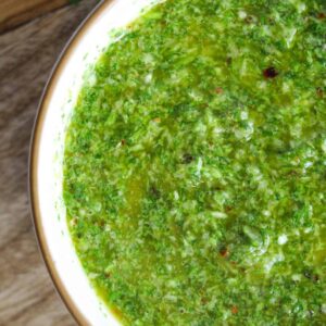 Close up shot of cilantro chimichurri in a small bowl.