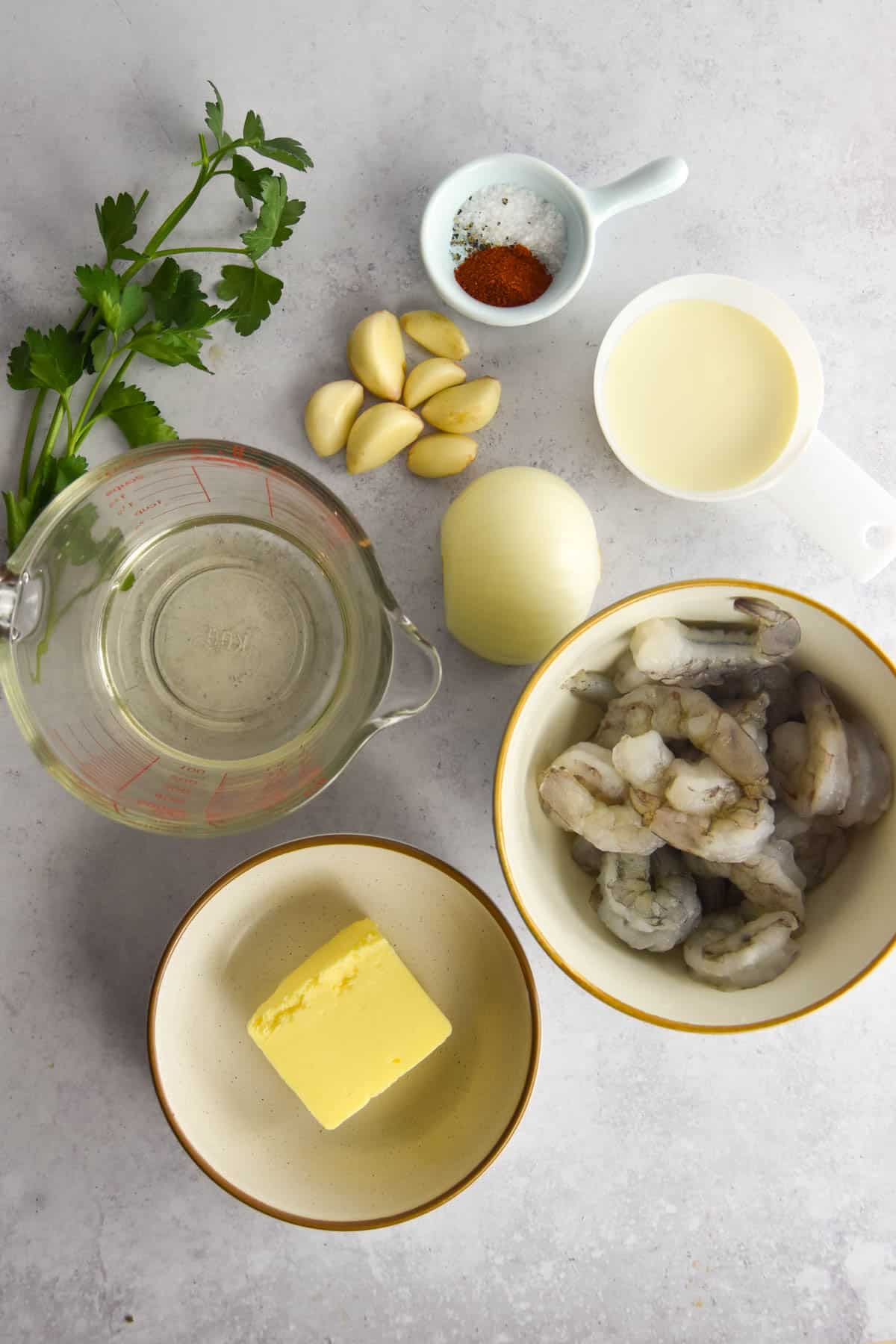 Ingredients needed for camarones al ajillo on a counter.