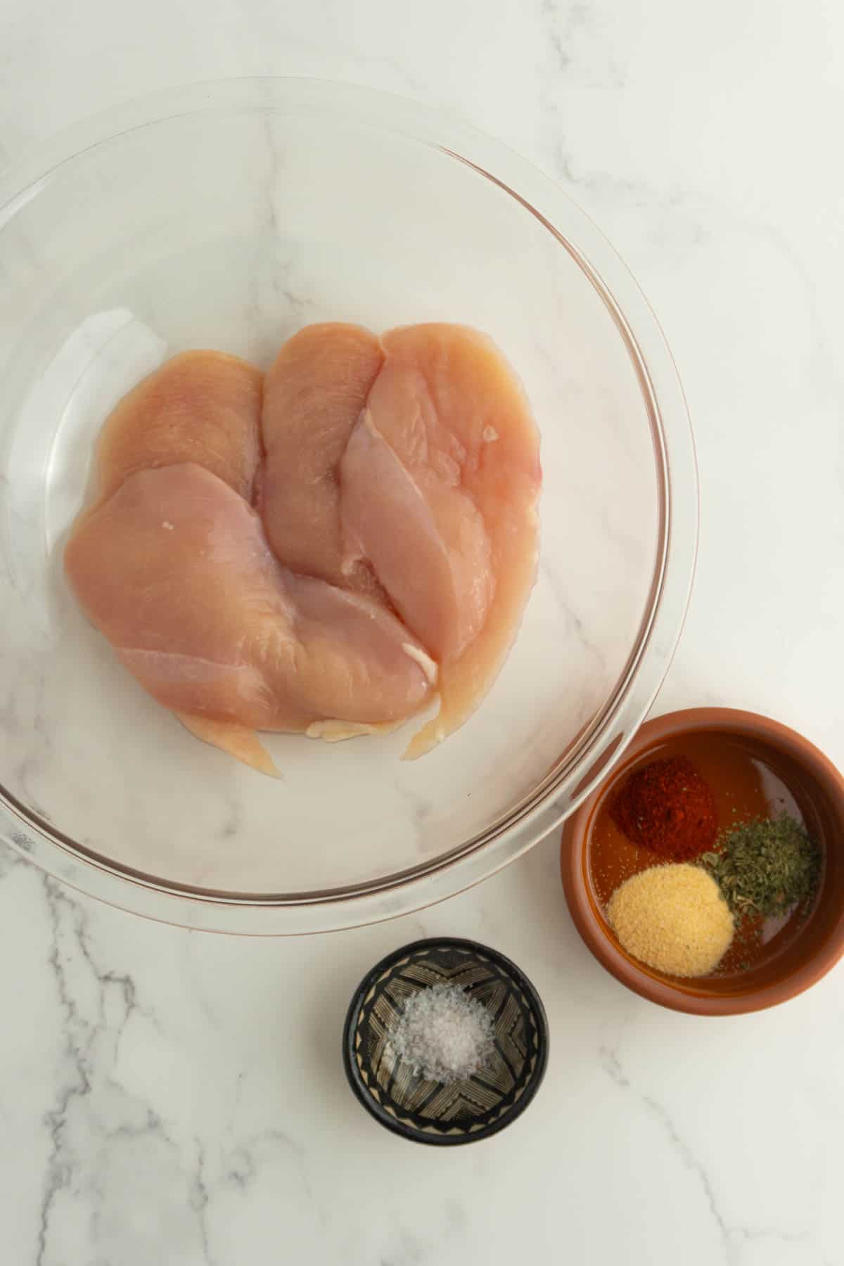 Overhead shot of ingredients needed to make cast iron chicken breasts.