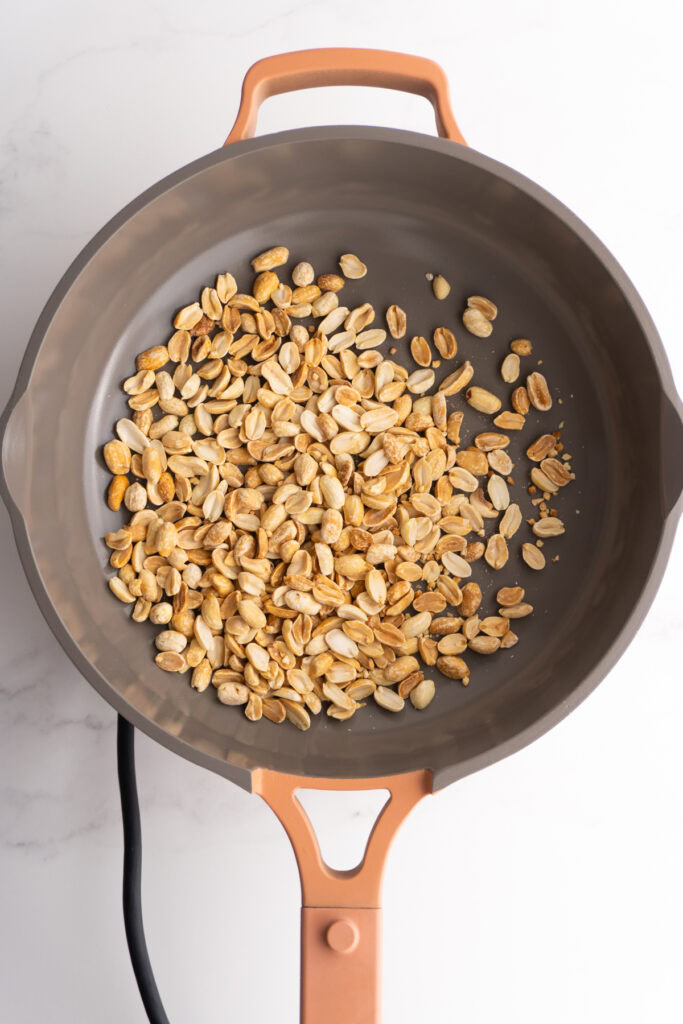 Peanuts toasting in the pan.