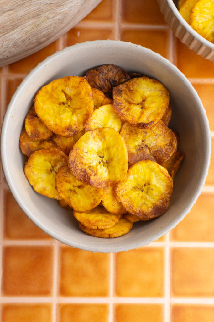 Maduritos chips served in a tan bowl on a counter.